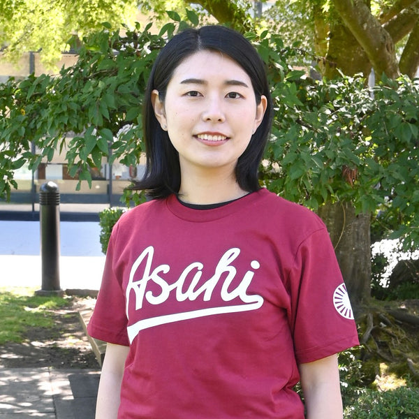 Woman wearing an Asahi t-shirt in Cranberry Red